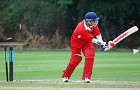 Hamad Zaman of Denmark is bowled during his side