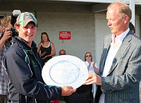 Ireland captain James Hall is presented with the Championship trophy.