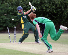 Adam Martel of Guernsey is bowled by Ireland's Craig Young during their 232 run defeat