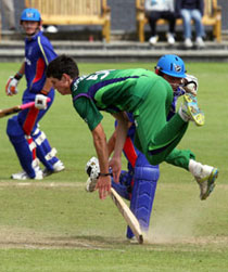 Ireland captain George Dockrell collides with a Namibian batsman during the match at Coleraine.